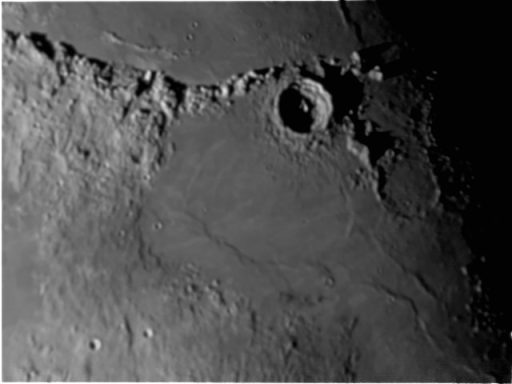 Eratosthenes Crater on the moon Lunar surface showing craters and uneven terrain in grayscale.