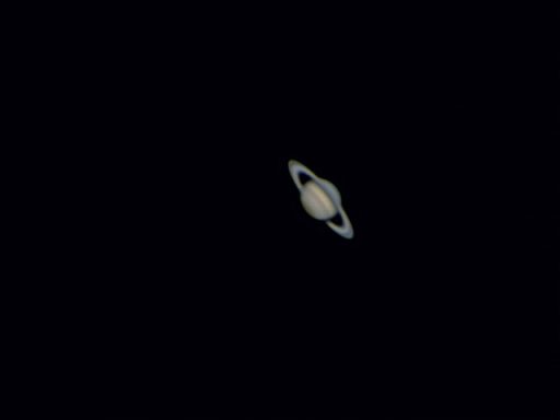 Saturn Saturn with its iconic rings against a dark background.