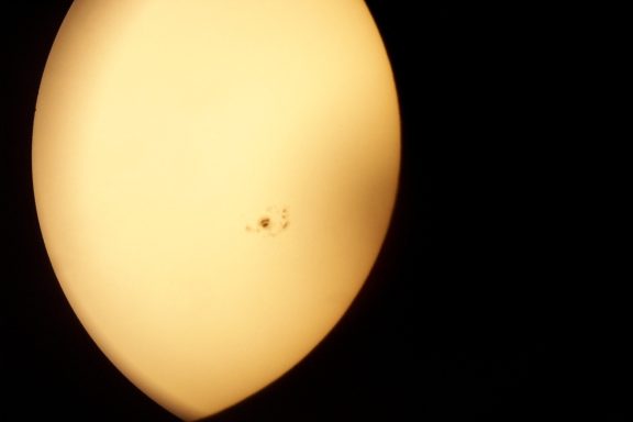 Sun Spots A round, soft surface illuminated with a small dark spot in the center.